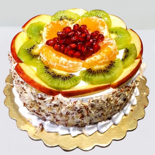 crushed coconut coated fruit cake topping with apple orange kiwi | GiftWale  Uncle